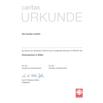 Urkunde zum Ehrenzeichen in Silber mit Eindruck "Für den Diözesan-Caritasverband"